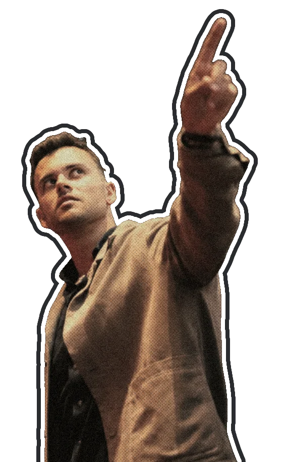 Ethan Monkhouse on stage, pointing