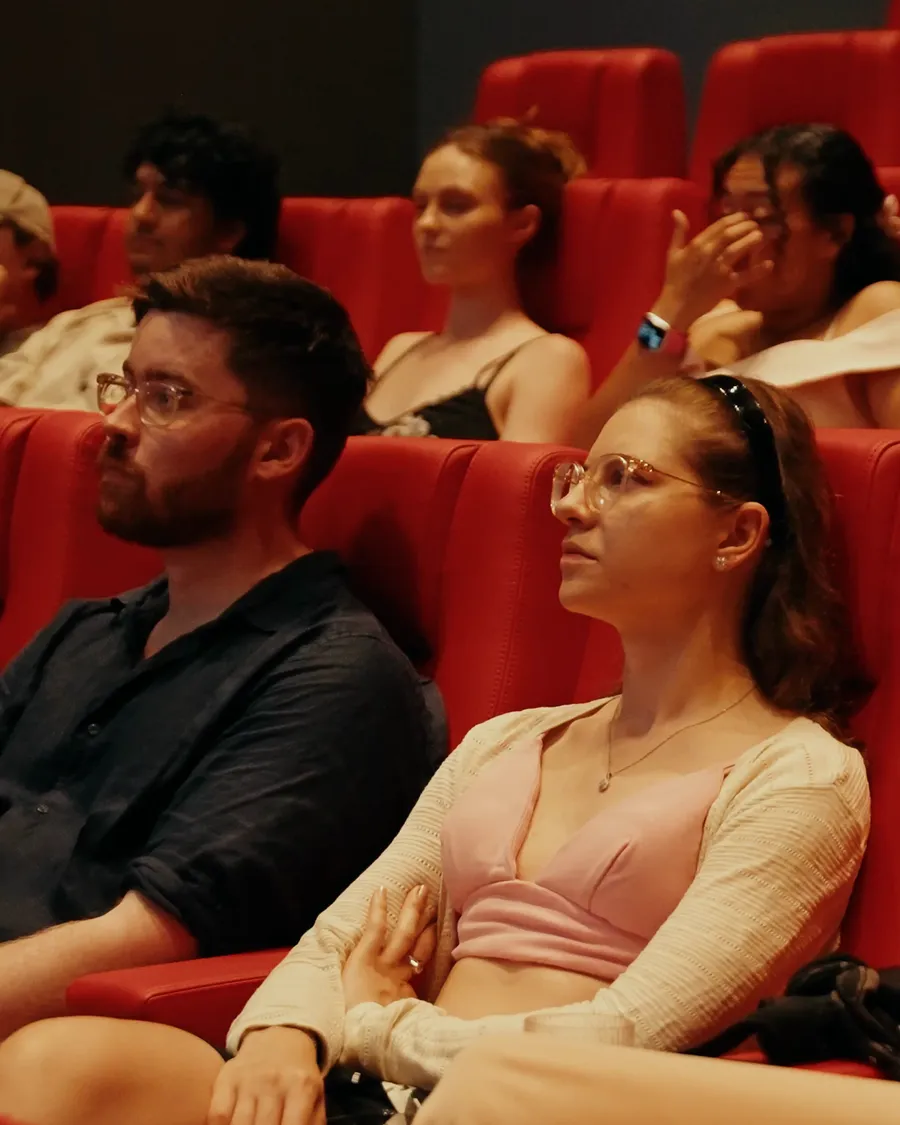 The audience watching a talk